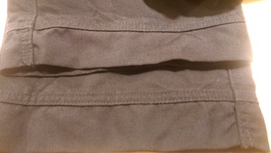 buks oplægning - oplægnign af arbejdsbukser - udskiftning af lynlås i buks  - oplæg buks med reflex kant - oplæg vinterbuks